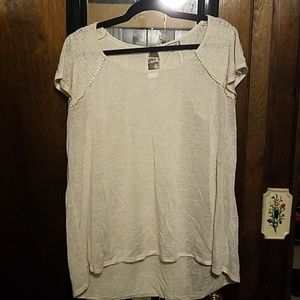 Cream colored short sleeve shirt